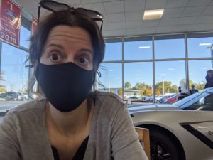 Me, masked in a car dealership